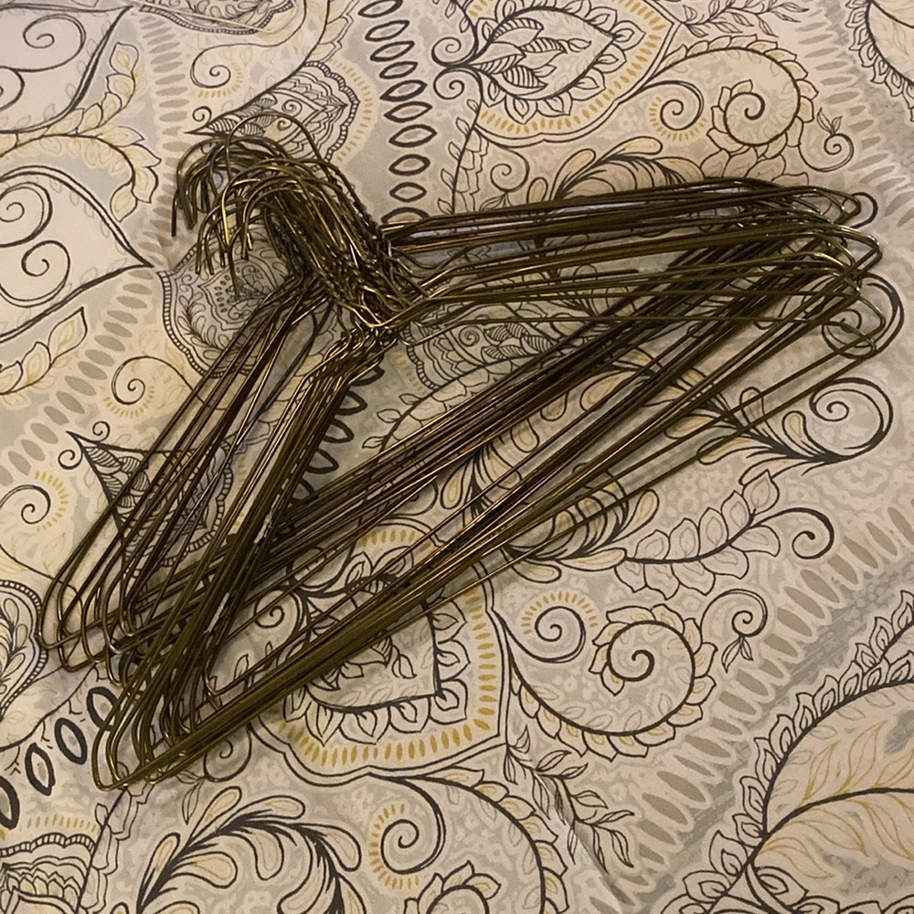 Twenty-Five (25) - Brassy Coloured Metal Wire Clothes Hangers